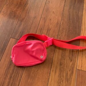 Lululemon hot pink fanny pack in excellent condition, never used.
